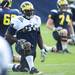 Michigan defensive tackle Jibreel Black stretches on the practice field outside of the Al Glick Field House on Thursday, August 8, 2013. Melanie Maxwell | AnnArbor.com 